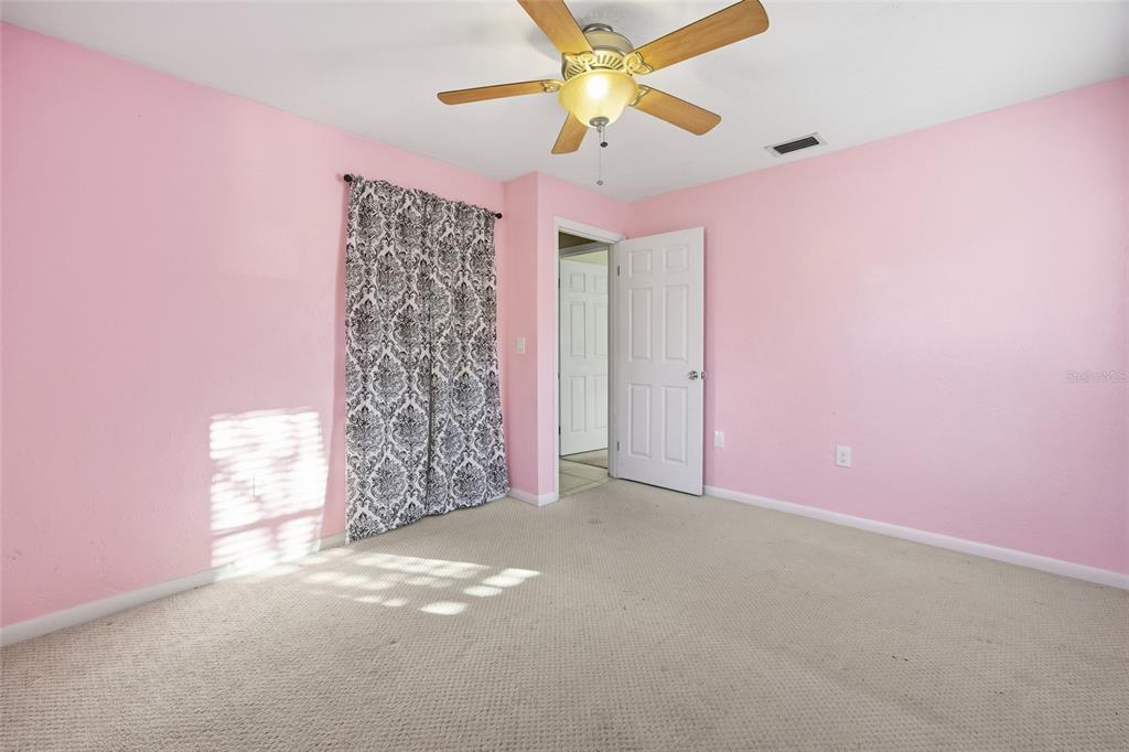 2140 Northeast 39th Street Ocala, FL 34479 - Photo 24 of 28 a view of a big room with closet and chandelier fan