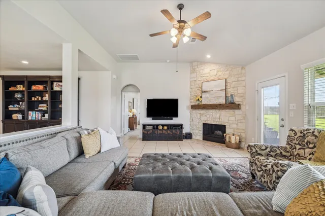 a bed room with a bed couch and a window