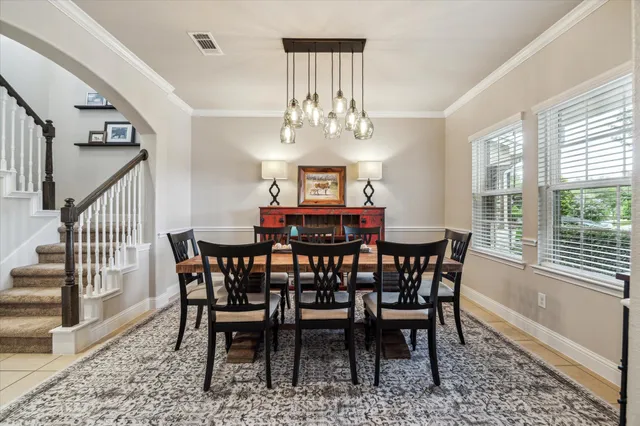 a kitchen with stainless steel appliances granite countertop a sink a stove top oven a counter space and cabinets