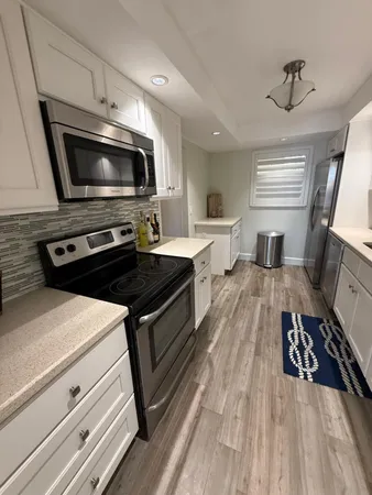 a kitchen with a stove and a microwave