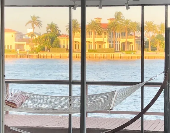 a view of a glass door with a tree