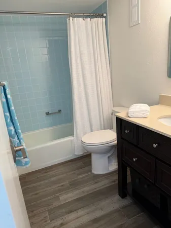 a bathroom with a sink a toilet and a bathtub