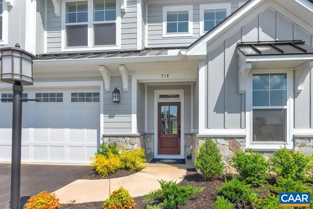 a view of a white building with many windows
