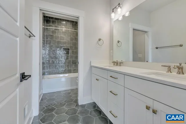 a bathroom with a bathtub and shower