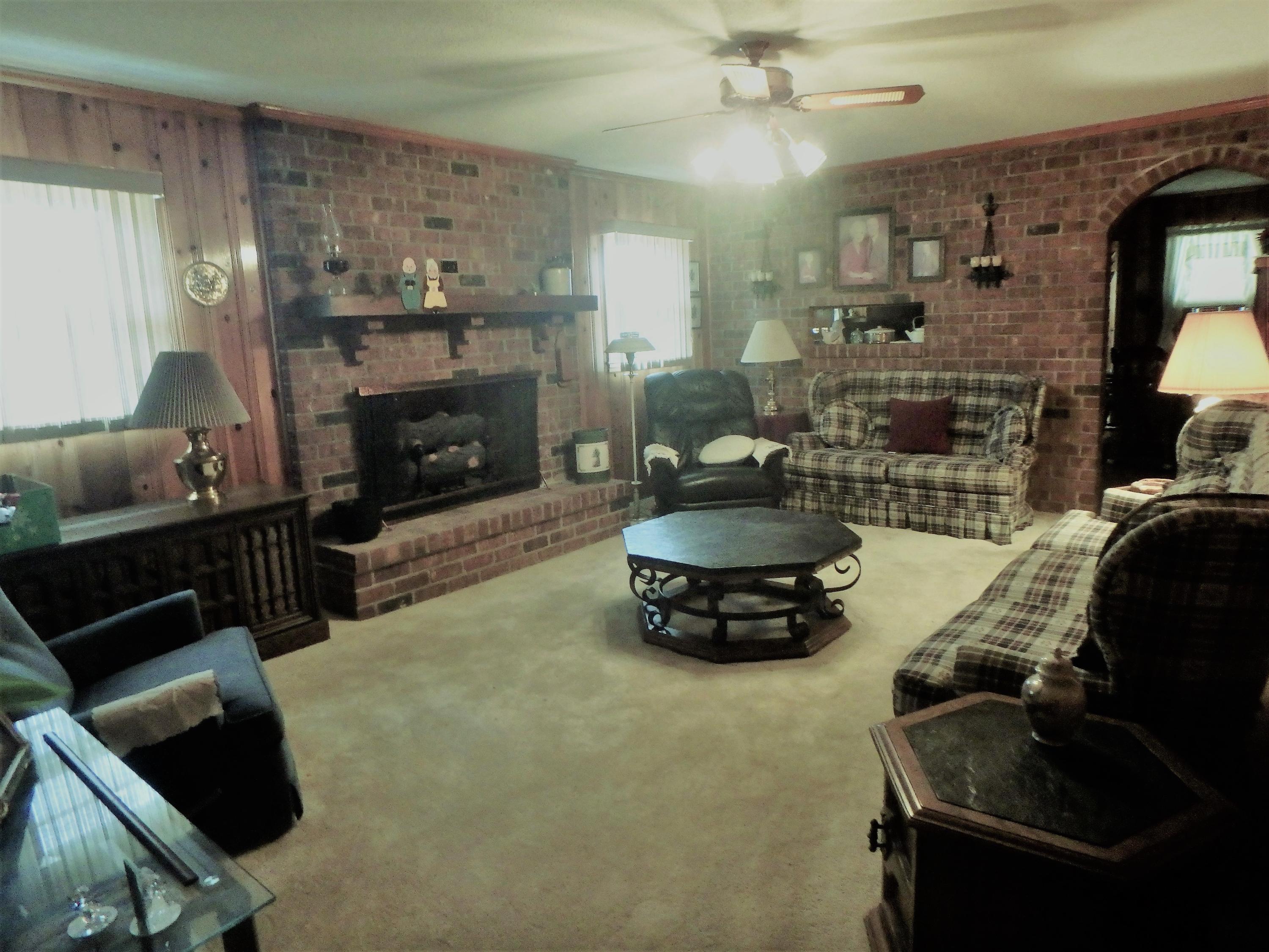 800 Horne Street St. George, SC 29477 - Photo 7 of 18 Den with Cozy Fireplace