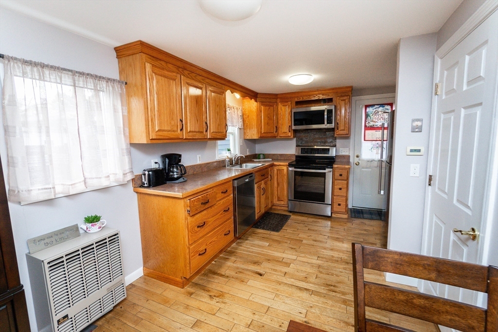3 Balsam Road Norton, MA 02766 - Photo 15 of 37 a kitchen with stainless steel appliances granite countertop a stove top oven a sink dishwasher and a refrigerator