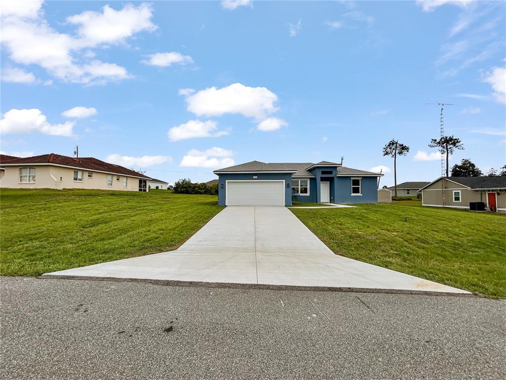 16212 Southwest 48th Circle Ocala, FL 34473 - Photo 2 of 17 a view of a house with a yard