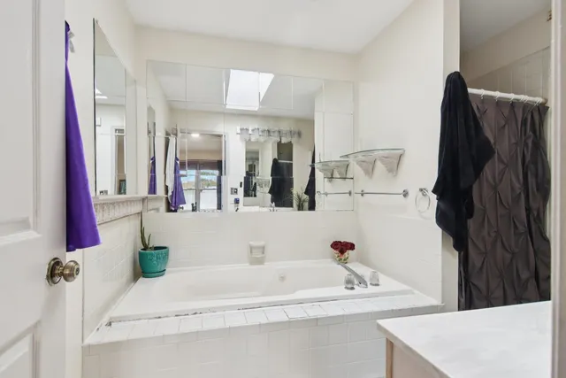 a bathroom with a bathtub and a sink
