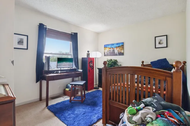 a bedroom with furniture and a window