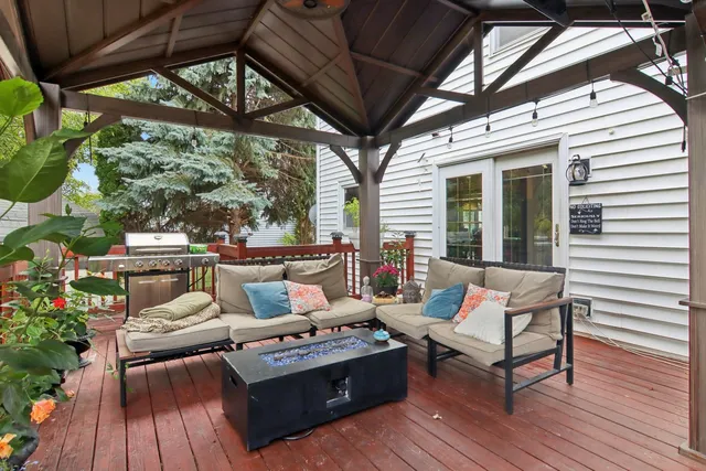 a outdoor living space with furniture and wooden floor