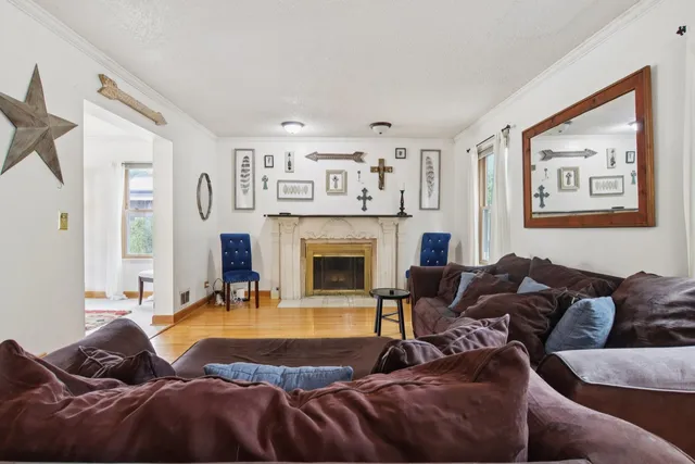 a living room with furniture and a fireplace