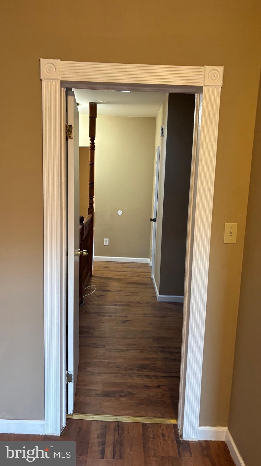 26 North Decker Avenue Baltimore, MD 21224 - Photo 10 of 14 a view of a hallway with wooden floor