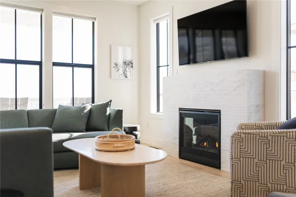 a living room with furniture and a fireplace