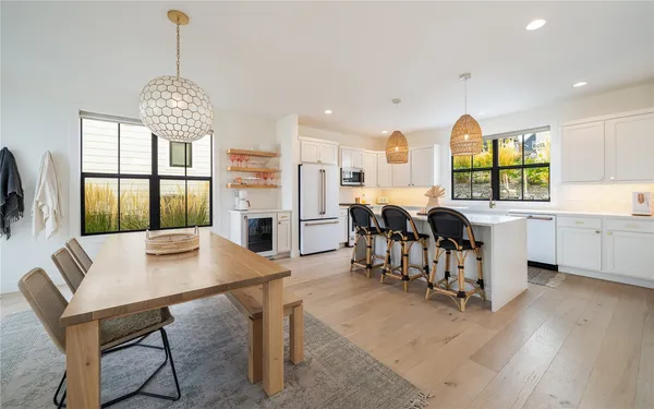 a view of a dining room with furniture window and outside view