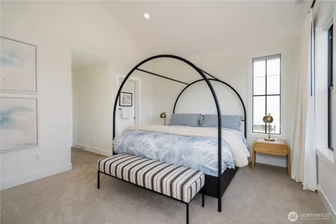 a bed room with a bed and a window