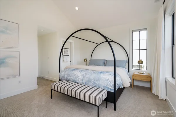 a bed room with a bed and a window
