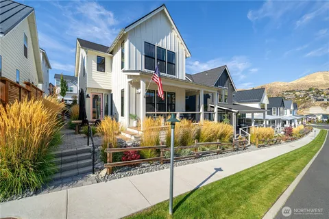 a swimming pool with outdoor seating and yard
