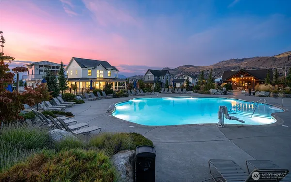an aerial view of houses with a swimming pool