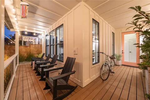 a view of a chairs and table on the deck with wooden floor