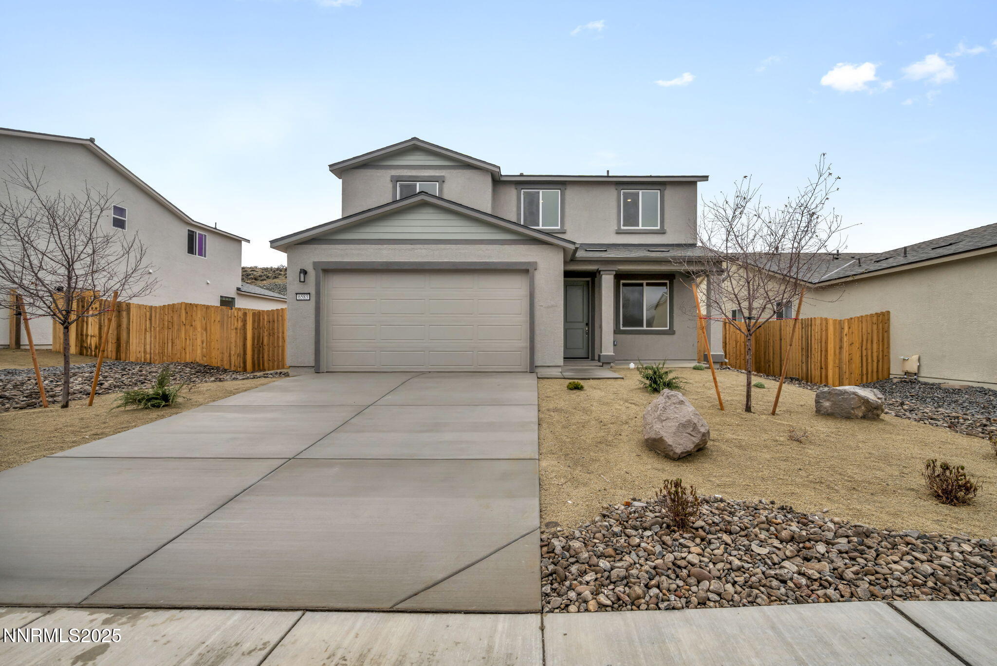 a front view of a house with backyard