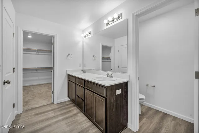 a bathroom with a sink a mirror and a shower