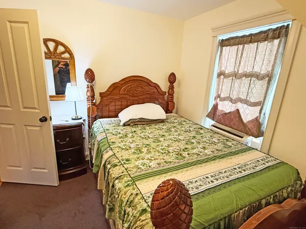 a bathroom with a sink a mirror and a toilet