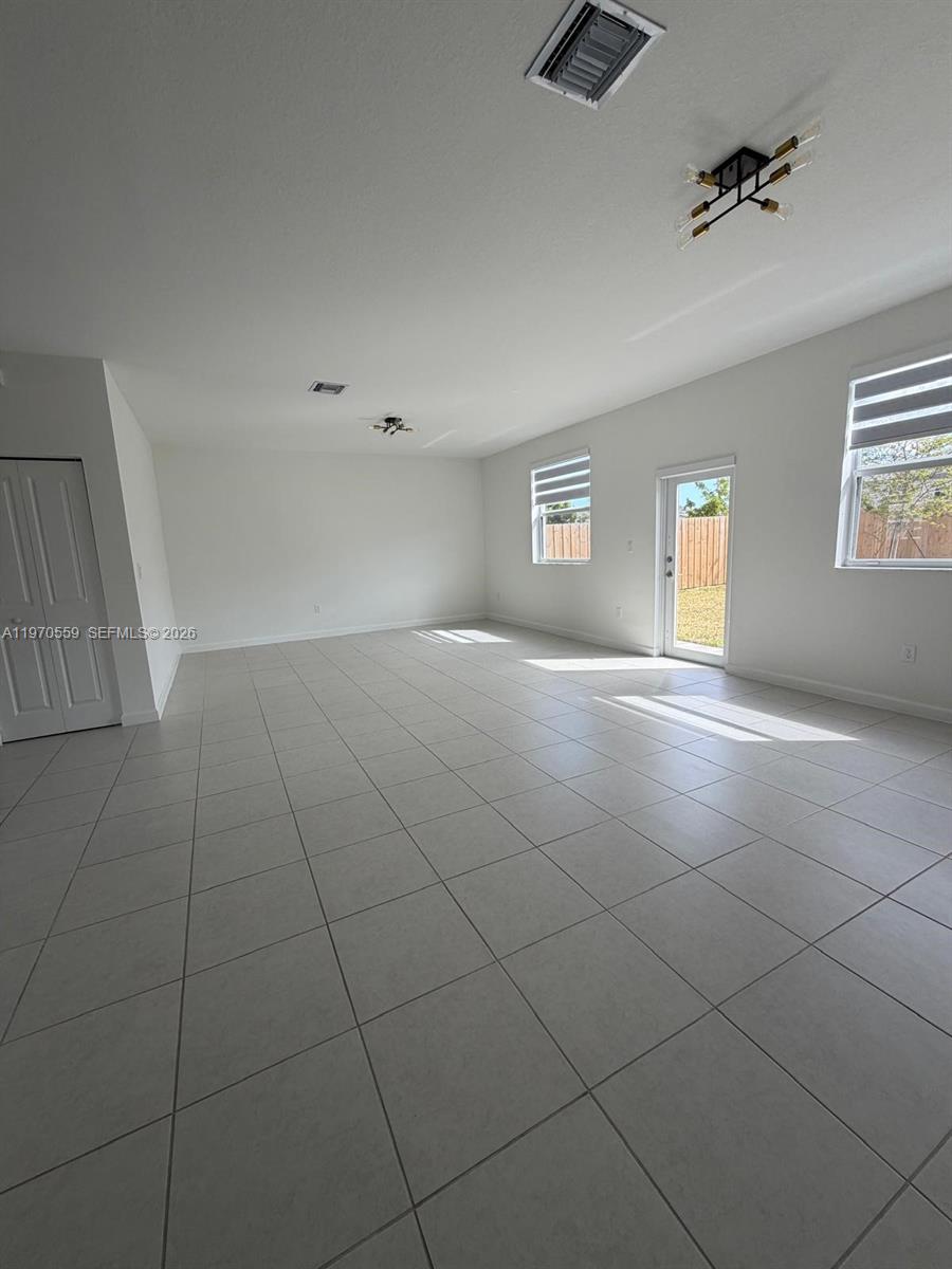2638 Southeast 9th Street Homestead, FL 33035 - Photo 13 of 36 a view of an empty room with a window