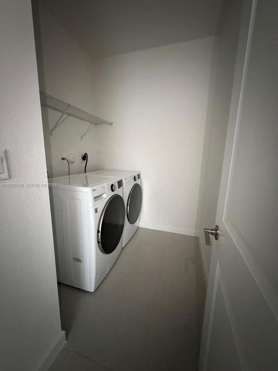 2638 Southeast 9th Street Homestead, FL 33035 - Photo 18 of 36 a utility room with dryer and washer