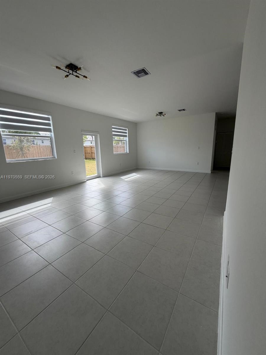 2638 Southeast 9th Street Homestead, FL 33035 - Photo 19 of 36 a view of an empty room with a window