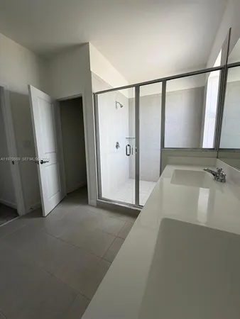 an empty room with a mirror