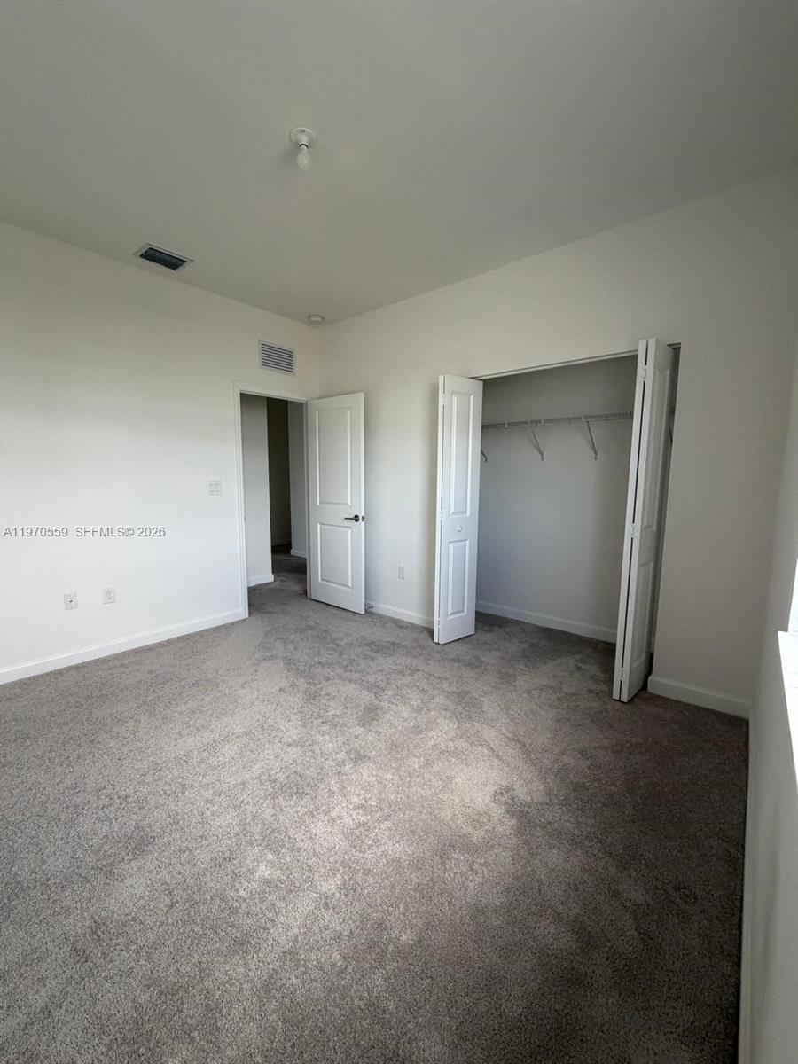 2638 Southeast 9th Street Homestead, FL 33035 - Photo 29 of 36 a view of an empty room and closet area