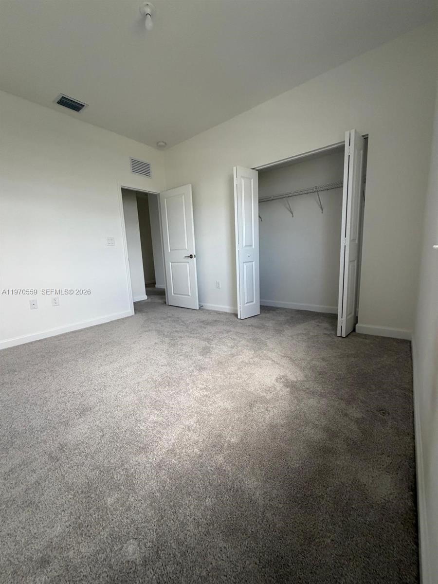 2638 Southeast 9th Street Homestead, FL 33035 - Photo 30 of 36 a view of an empty room and closet area
