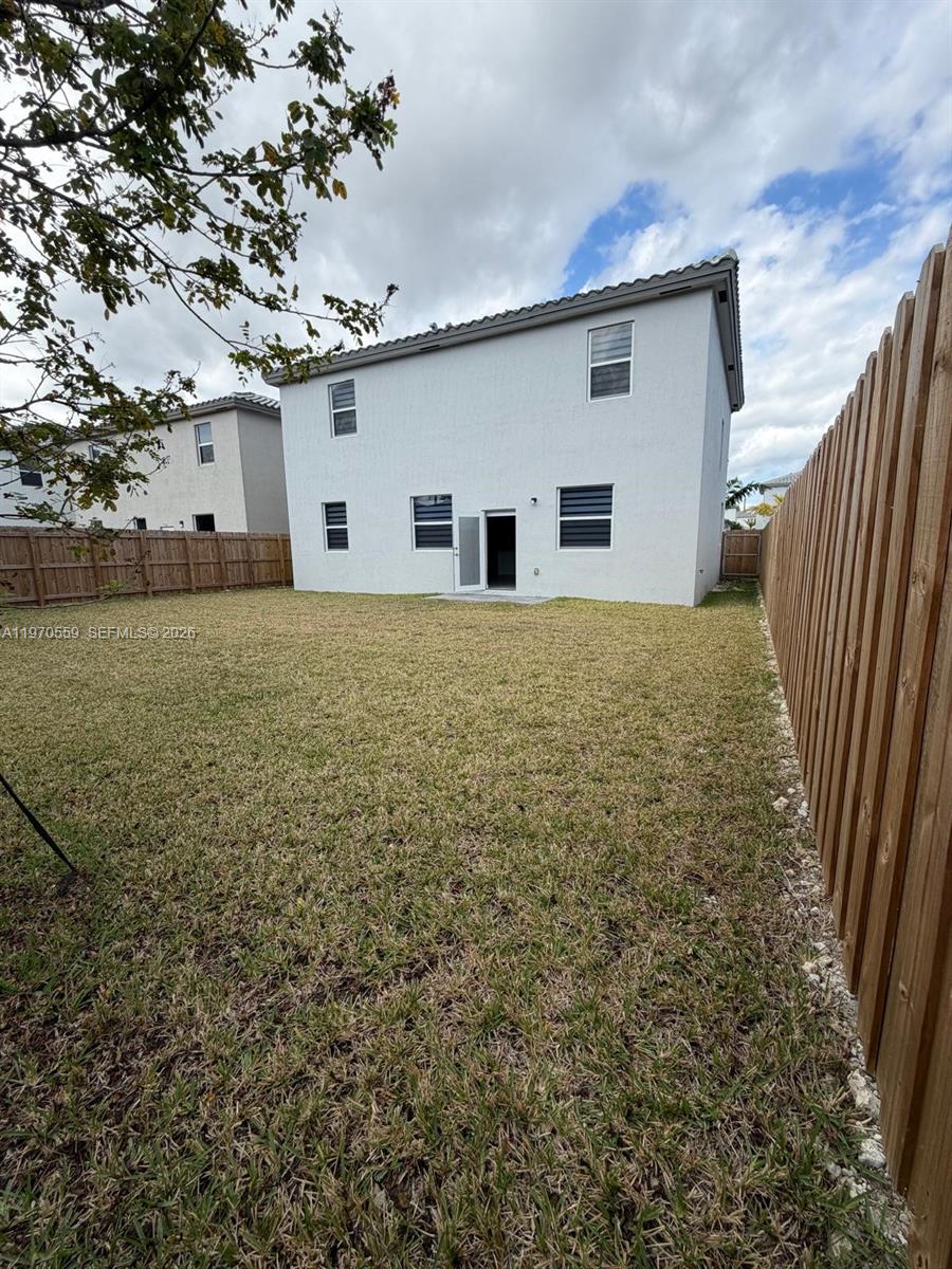 2638 Southeast 9th Street Homestead, FL 33035 - Photo 35 of 36 a view of backyard of house and trees