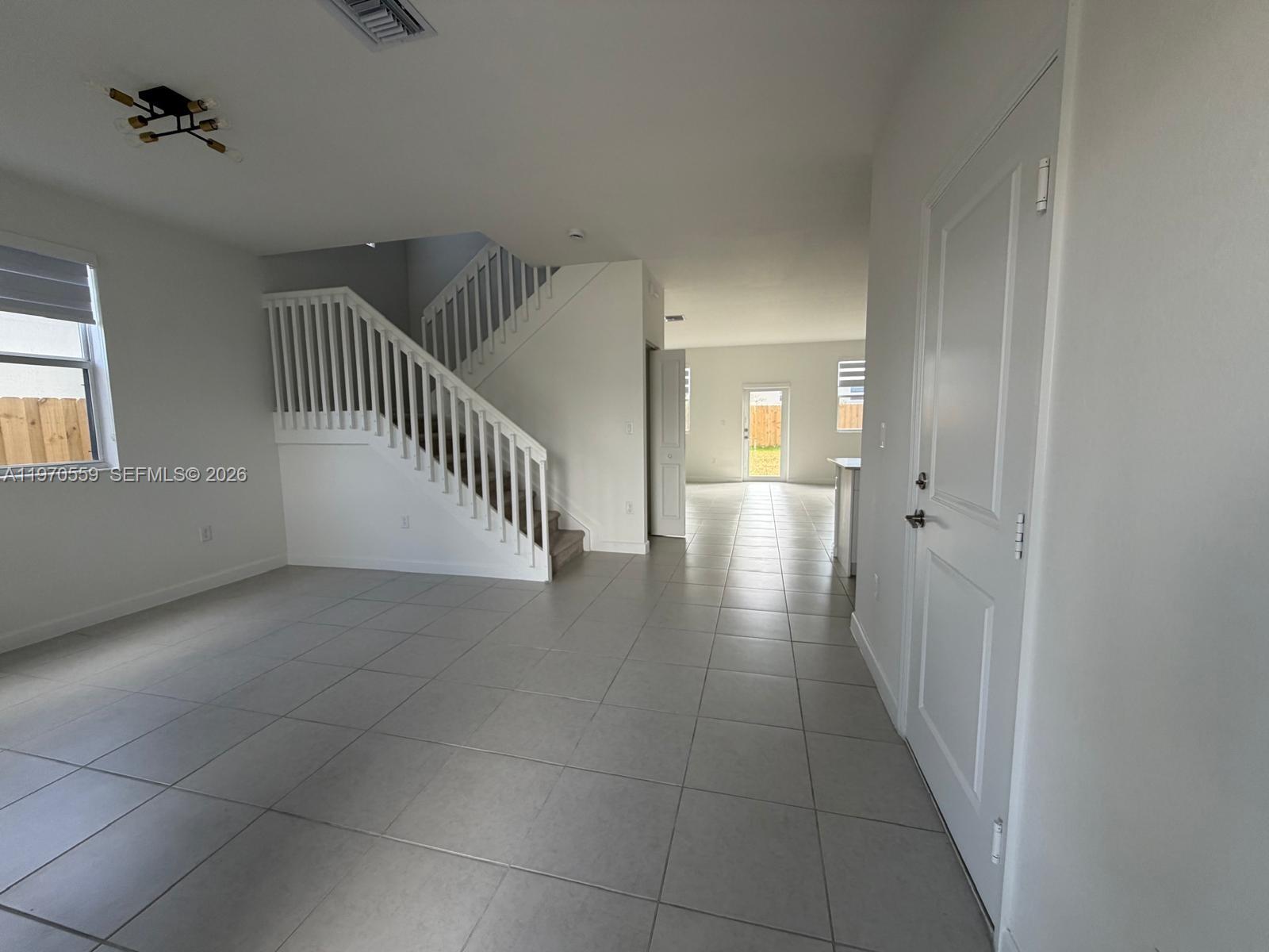 2638 Southeast 9th Street Homestead, FL 33035 - Photo 4 of 36 wooden floor in a hall with a window