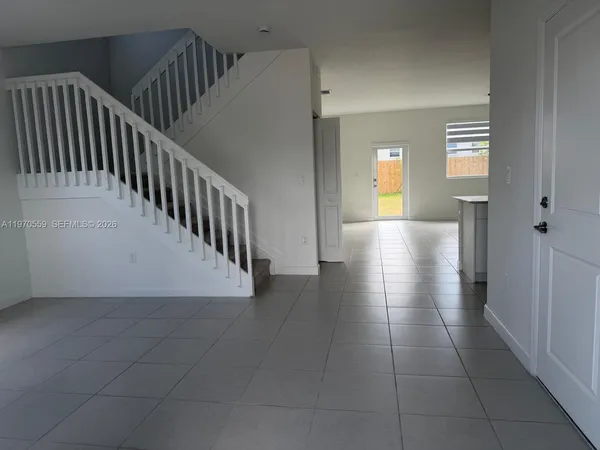 a view of a hallway view with staircase