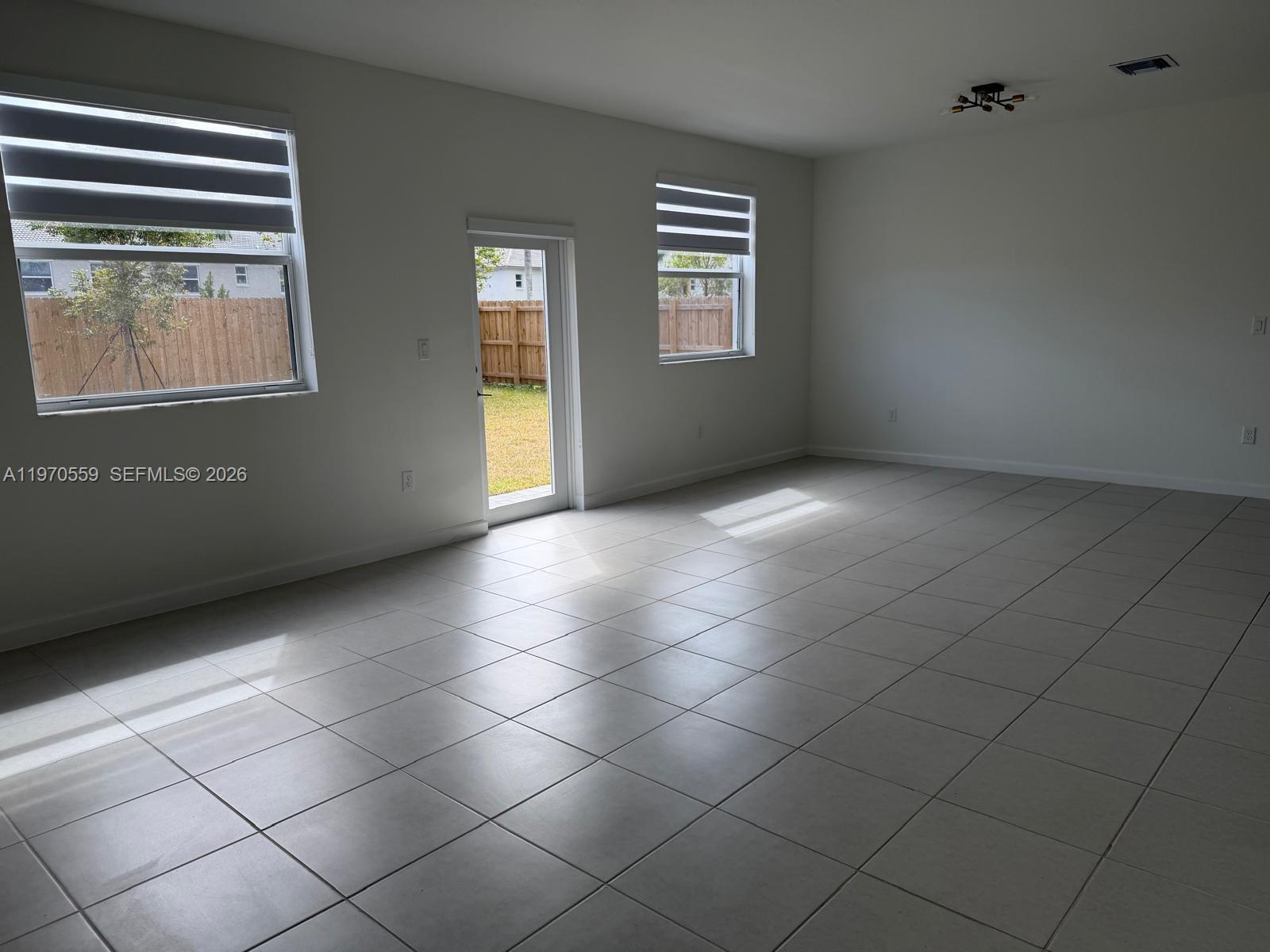 2638 Southeast 9th Street Homestead, FL 33035 - Photo 7 of 36 a view of an empty room with a window