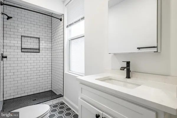 a kitchen with a refrigerator sink and microwave