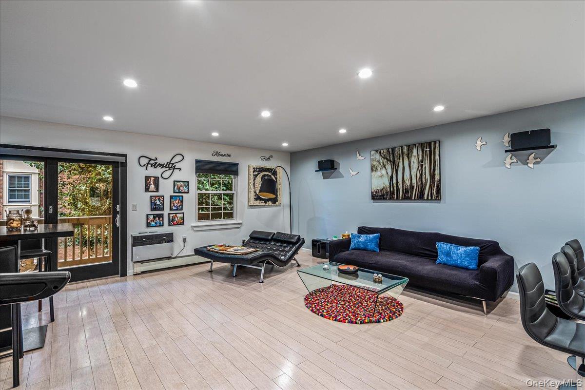 208-06 Robert Road, Unit 2 Queens, NY 11360 - Photo 10 of 26 a living room with furniture and a wooden floor