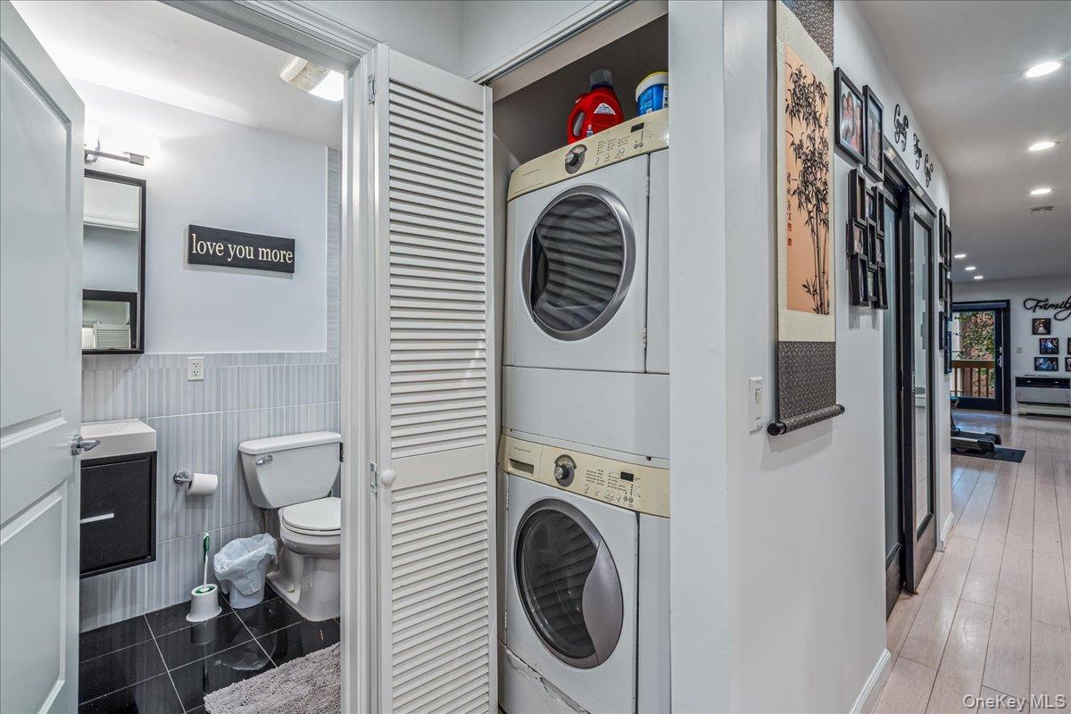 208-06 Robert Road, Unit 2 Queens, NY 11360 - Photo 14 of 26 a utility room with dryer and washer
