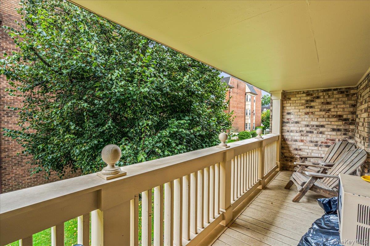 208-06 Robert Road, Unit 2 Queens, NY 11360 - Photo 15 of 26 a view of balcony with wooden floor