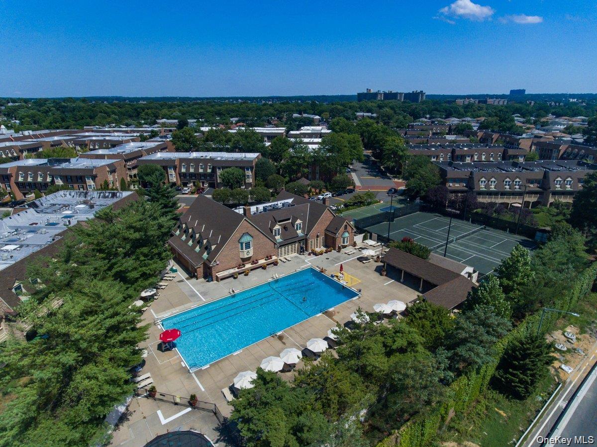 208-06 Robert Road, Unit 2 Queens, NY 11360 - Photo 22 of 26 an aerial view of residential houses with outdoor space and trees