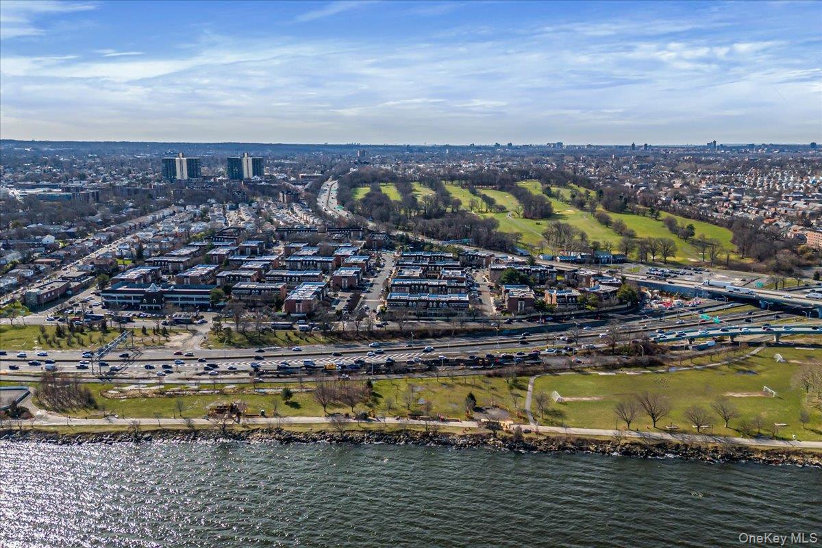 208-06 Robert Road, Unit 2 Queens, NY 11360 - Photo 23 of 26 a view of a lake with a city