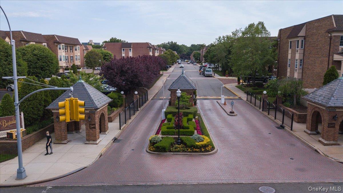 208-06 Robert Road, Unit 2 Queens, NY 11360 - Photo 24 of 26 a aerial view of multiple houses with a yard
