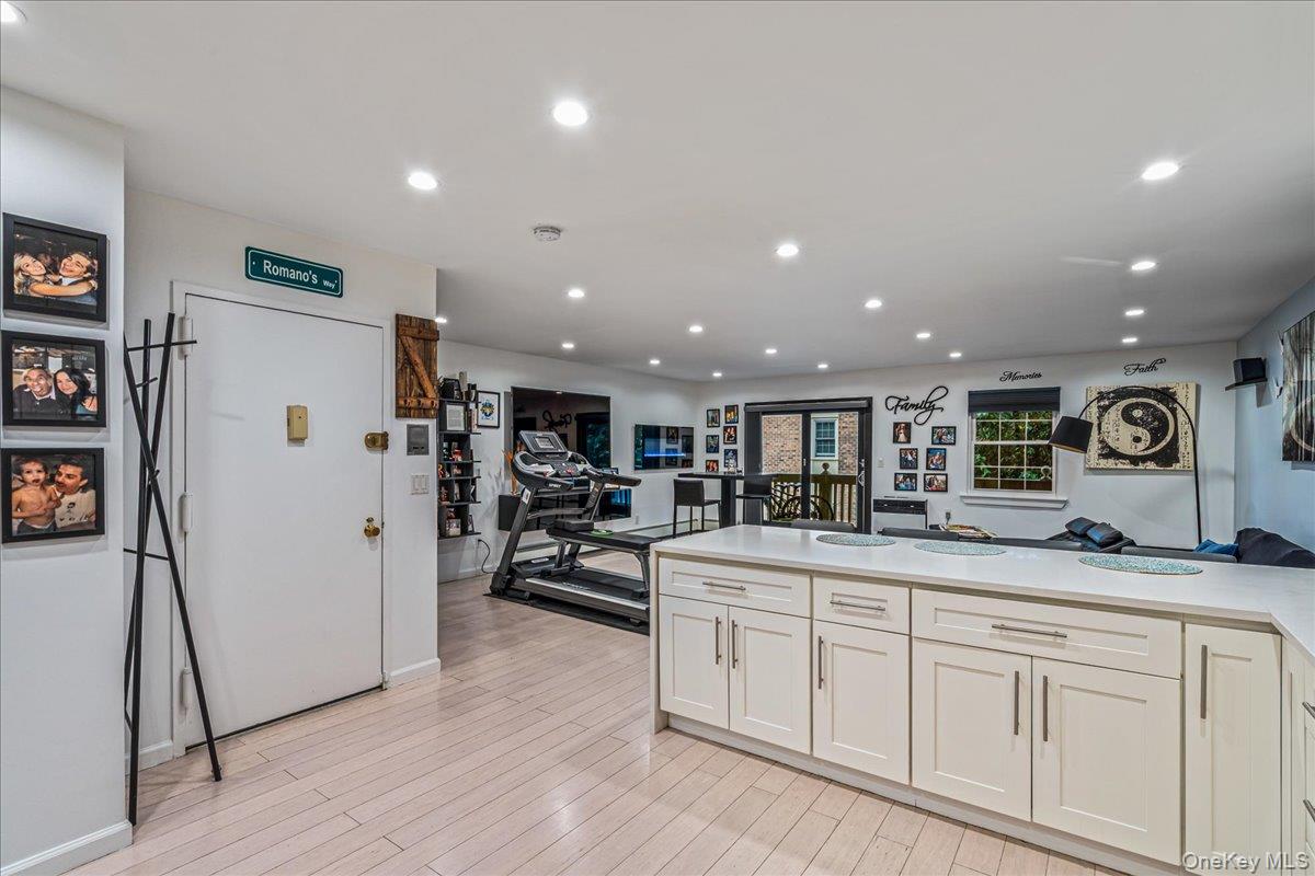 208-06 Robert Road, Unit 2 Queens, NY 11360 - Photo 25 of 26 a kitchen with stainless steel appliances granite countertop a refrigerator and a sink