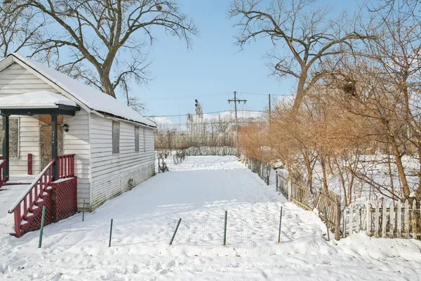 a view of a backyard of the house