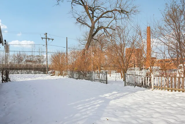 a view of a house with a snow on the road