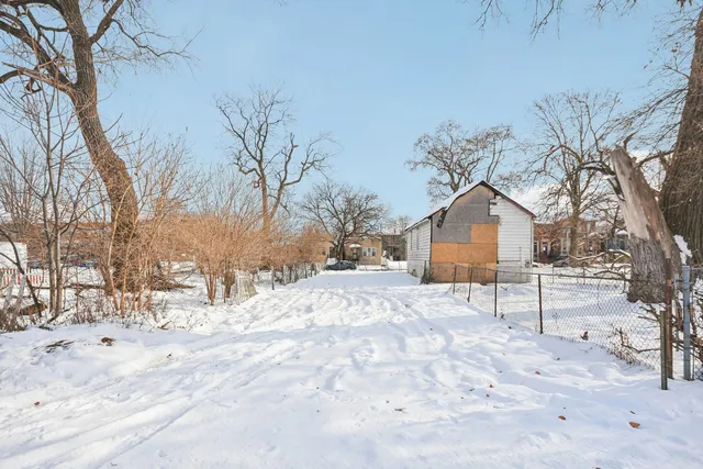 a view of a house with a snow in the yard