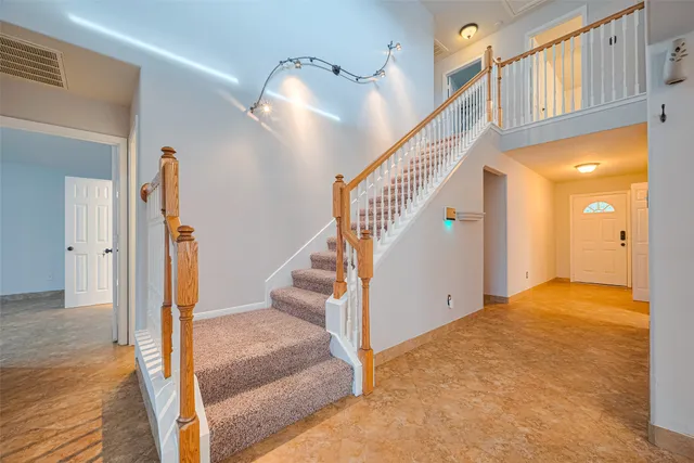 a bathroom with a tub a sink and a mirror