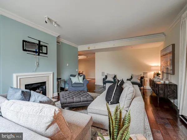 a living room with furniture fireplace and flat screen tv
