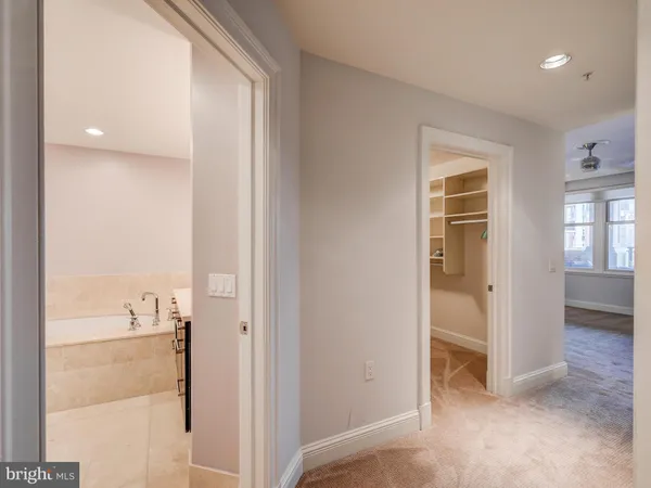 a view of a bathroom with sink and mirror